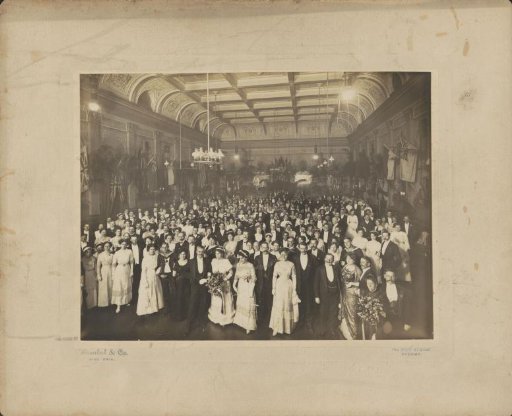 Group portrait of a company in a banquet hall, presumably in Sydney