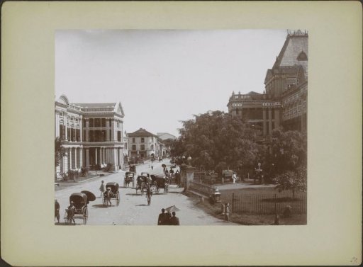 South Bridge Road in Singapore with rickshaws and (on the right) the police station