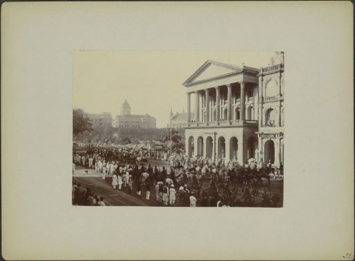 Mounted procession and public on the street in Bombay