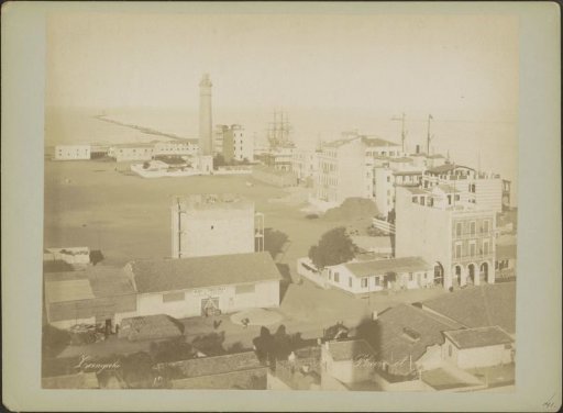 View of buildings, the lighthouse and the entrance of the Suez Canal at Port Said