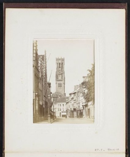 Steenstraat in Bruges with the belfry at the end