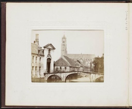 View of a gate, a bridge and the St. Salvator's Cathedral in Bruges
