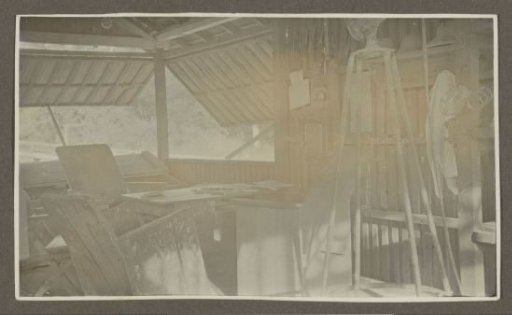 Interior of a wooden house with open shutters