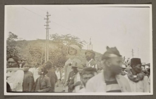 Parade with giant puppets and spectators