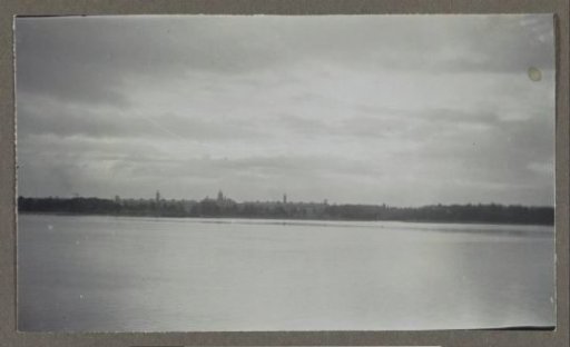 View from the sea of a city with church towers