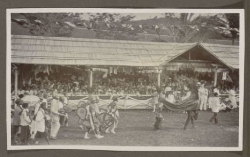 Parade with participants portraying riders before a tribune