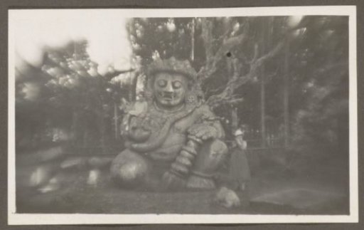 Two women before a Hindu image