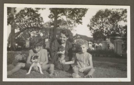 Woman with two children and two dogs