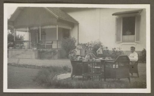 Man and woman with two children in a garden