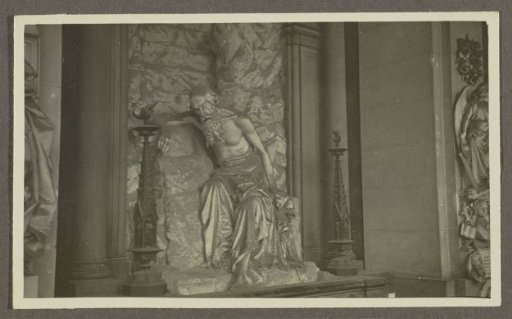 Statue of a mourning man with a beard