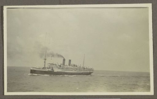 Passenger ship with a smoking chimney at sea