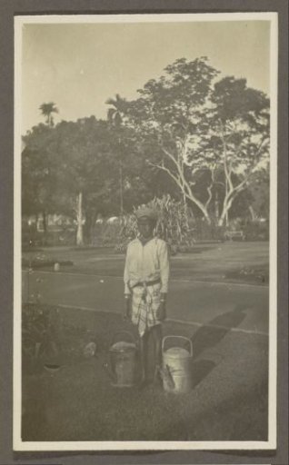 Boy with two watering cans