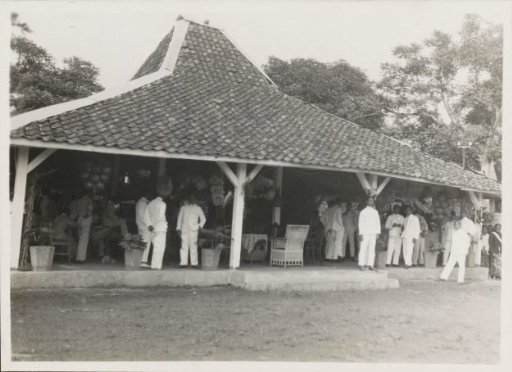 Men posing with agricultural products at a pendoppo in Gedong Tataan