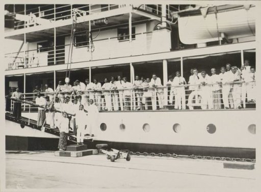 Men posing on board the ship Van Outhoorn