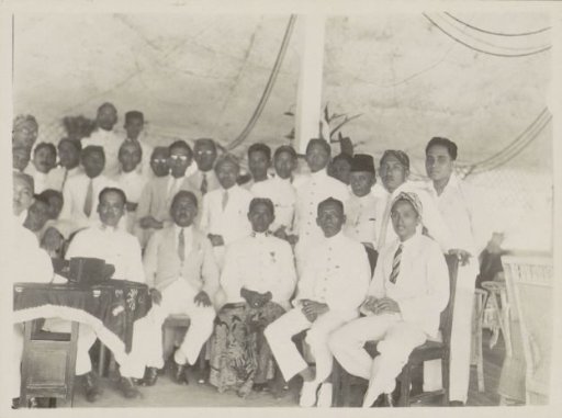 Men gathered in a pendoppo in Gadingredjo