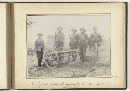 Men, presumably Boers, at a captured English cannon at Modderspruit