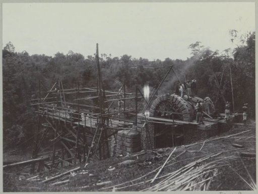Construction of an arch and bridge end at an abutment on the western bank of the Kali Brantas south of Malang (Photo XVI)