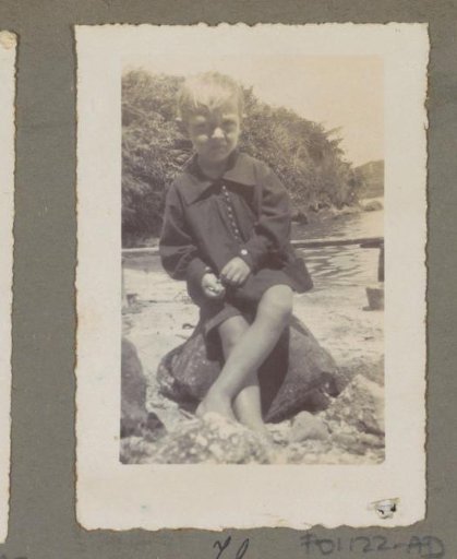 Hans Bergsma seated on a stone by a stream in Sumatra