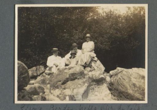 Group portrait of Eiso, Gerda and Netta Bergsma and Dr. De Jong on rocks at Brastagi