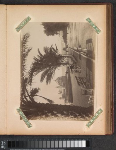 Boulevard in Nice with a pier and buildings on the left
