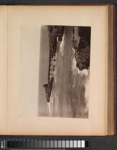 View of a bridge between rocks, presumably on the coast near Monaco