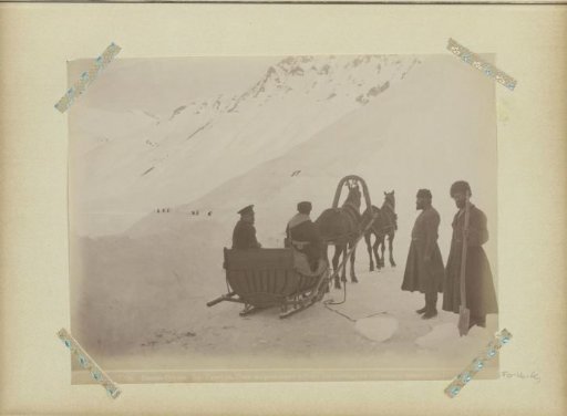 Horse-drawn sleigh and snow-clearers on the military road in Georgia