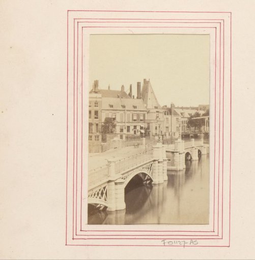 Halfmoon Bridge over the Amstel and Swygh Utrecht tower in Amsterdam