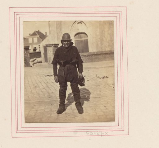 Portrait of an unknown Scheveningen fisherman, standing in front of the Old Church in The Hague