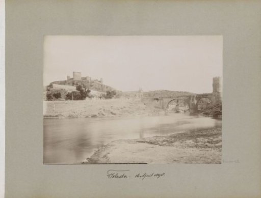 Toledo with bridge and castle, seen across the Tagus