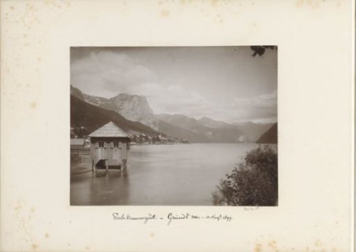 View of the Grundlsee in the Salzkammergut, with village and house and surrounding mountains