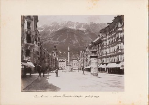 Maria-Theresien Street in Innsbruck with shops, public, advertising pillar and statue