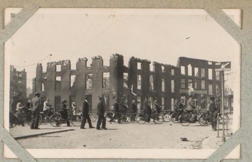 Cyclists near the ruins of the Marines Barracks on the Oostplein in Rotterdam