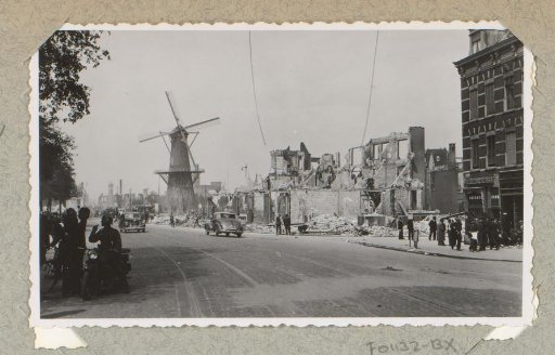 Ruins of buildings at the Oostzeedijk in Rotterdam, with mill and public
