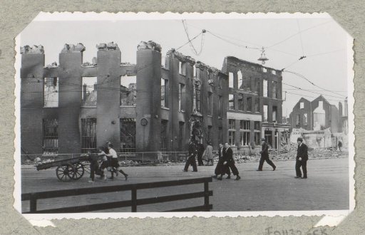 Pedestrians in front of the ruins of the Marines Barracks in Rotterdam