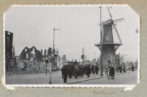Persons at the ruins and mill at the Oostplein in Rotterdam