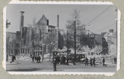 Persons at ruins along the Coolsingel in Rotterdam