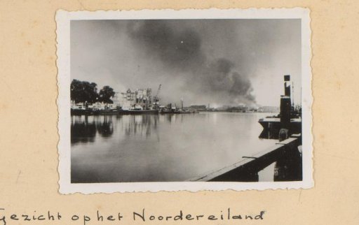 View of Rotterdam with smoke clouds over the city, seen from the Boompjes