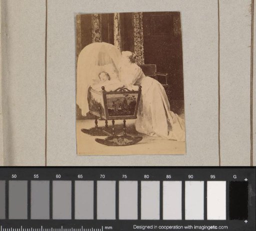 Photoreproduction of an engraving of a praying woman by a cradle