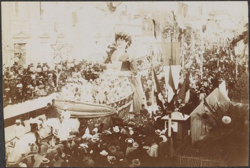 Parade with spectators and floats, possibly in Menton