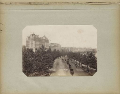 Horse-drawn carriages on the Thames Embankment in London with the Hotel Cecil and Savoy in the background