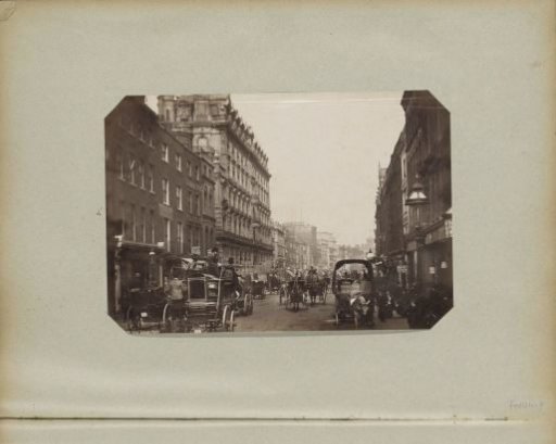 Street in Holborn in London with horse-drawn carriages and the First Avenue Hotel