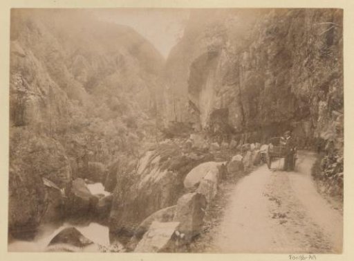 Gorge in the Brattland Valley in Norway with man and cart