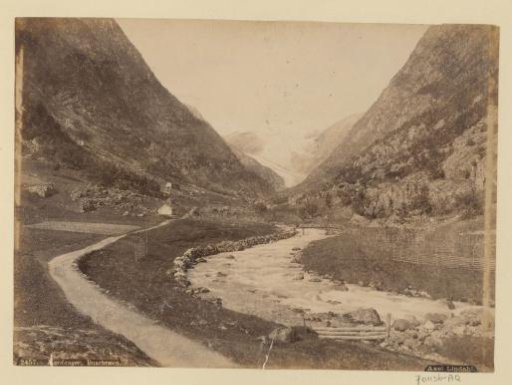 Valley in Norway near the Buer Glacier with river and fields