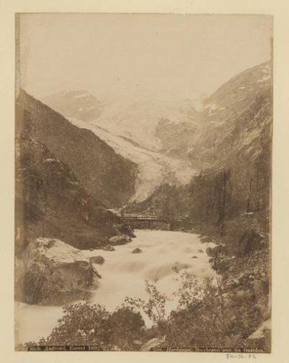 Buer Glacier in Norway with a bridge over a stream in the foreground