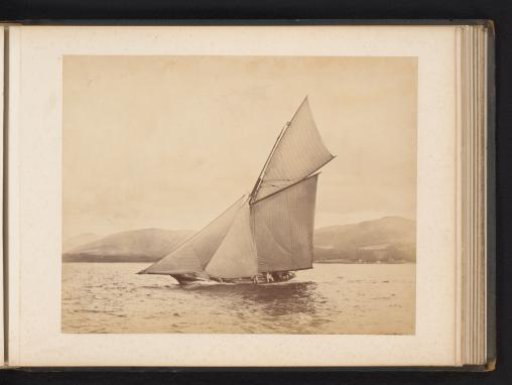 Sailing ship Idalia No. 1 launched with a hilly landscape in the background