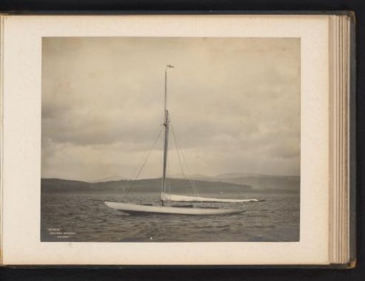 Sailing ship Deirdré launched with a hilly landscape in the background