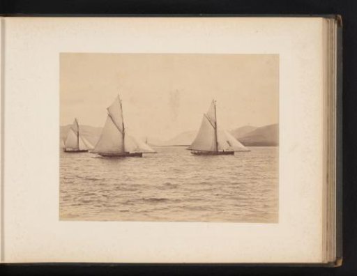 Sailing ships Dione, Amcosona and Neva afloat with a hilly landscape in the background