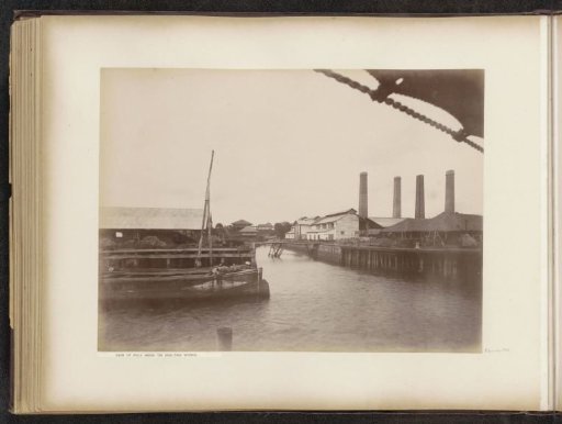 View of the tin smelters on the island of Pulau Brani near Singapore