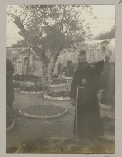 Franciscan monk in the garden of Gethsemane at the foot of the Mount of Olives in Jerusalem