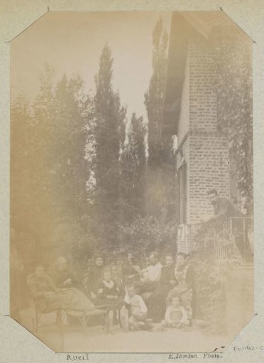 Group portrait of a French family in a garden in Rueil